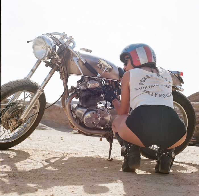 A playful frame from Girls on a motorcycle — online in Calgary